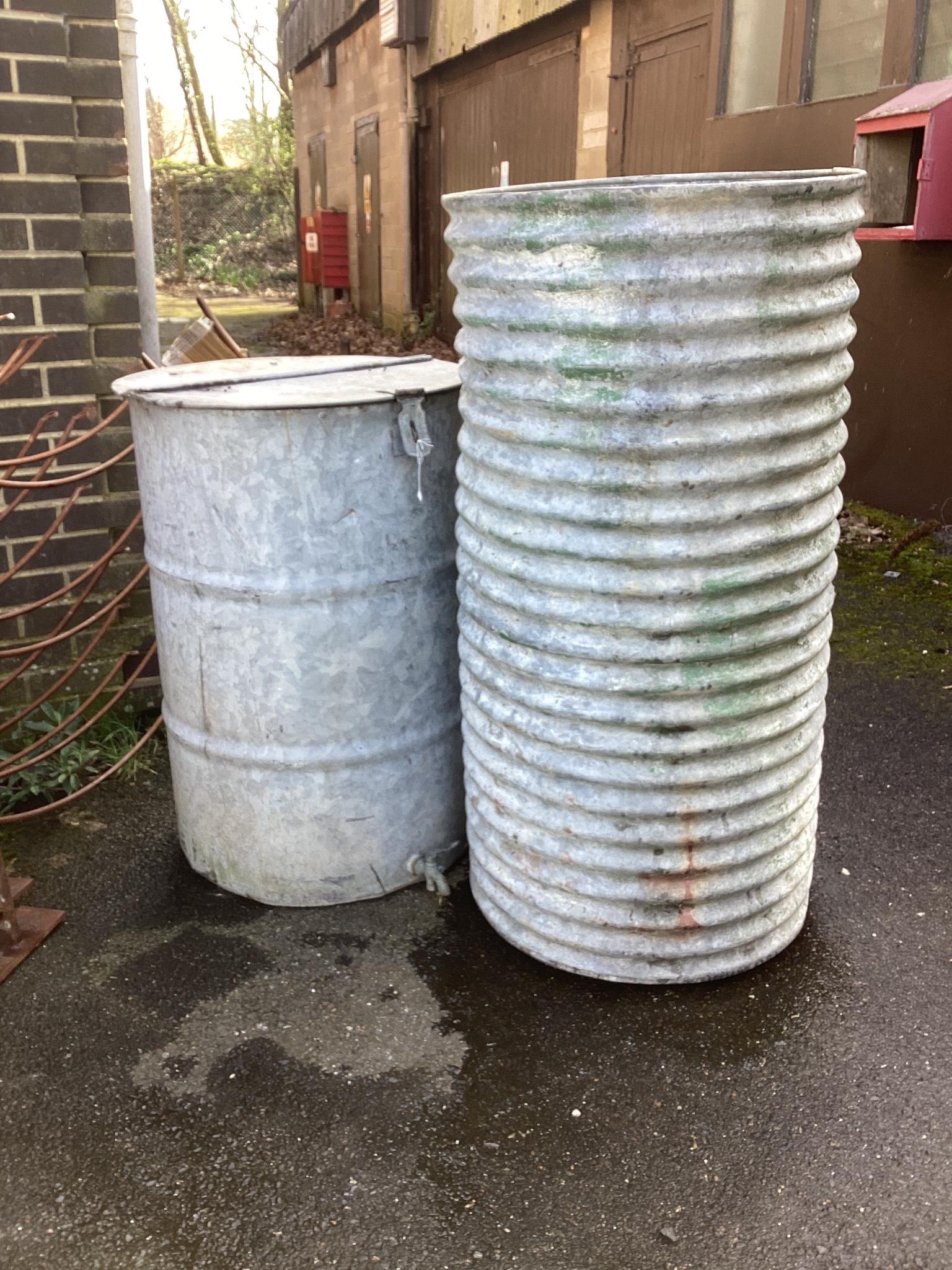 A galvanised water butt and a grain bin, larger height 124cm